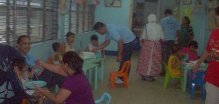 EISI employees feeding the children of Home of Joy